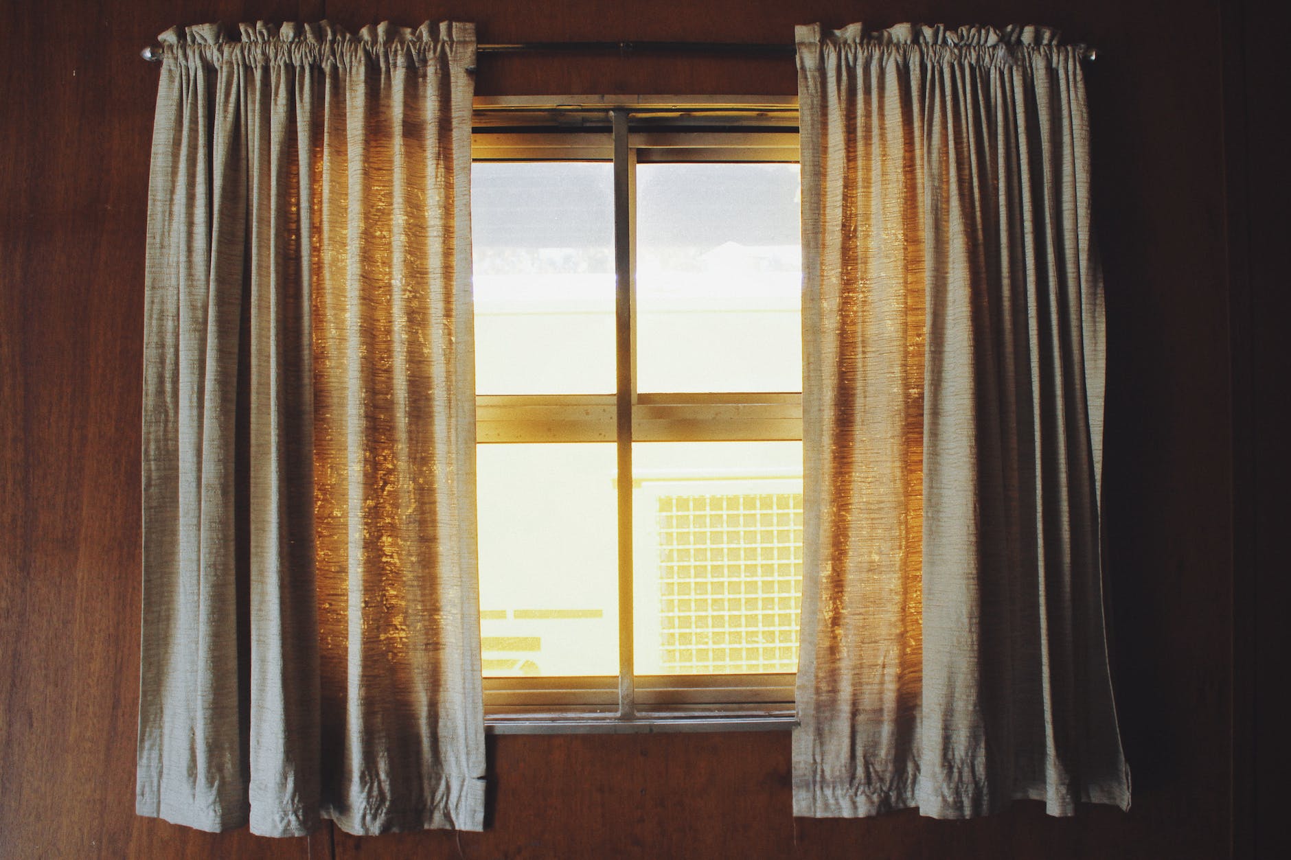 two white rod pocket curtains