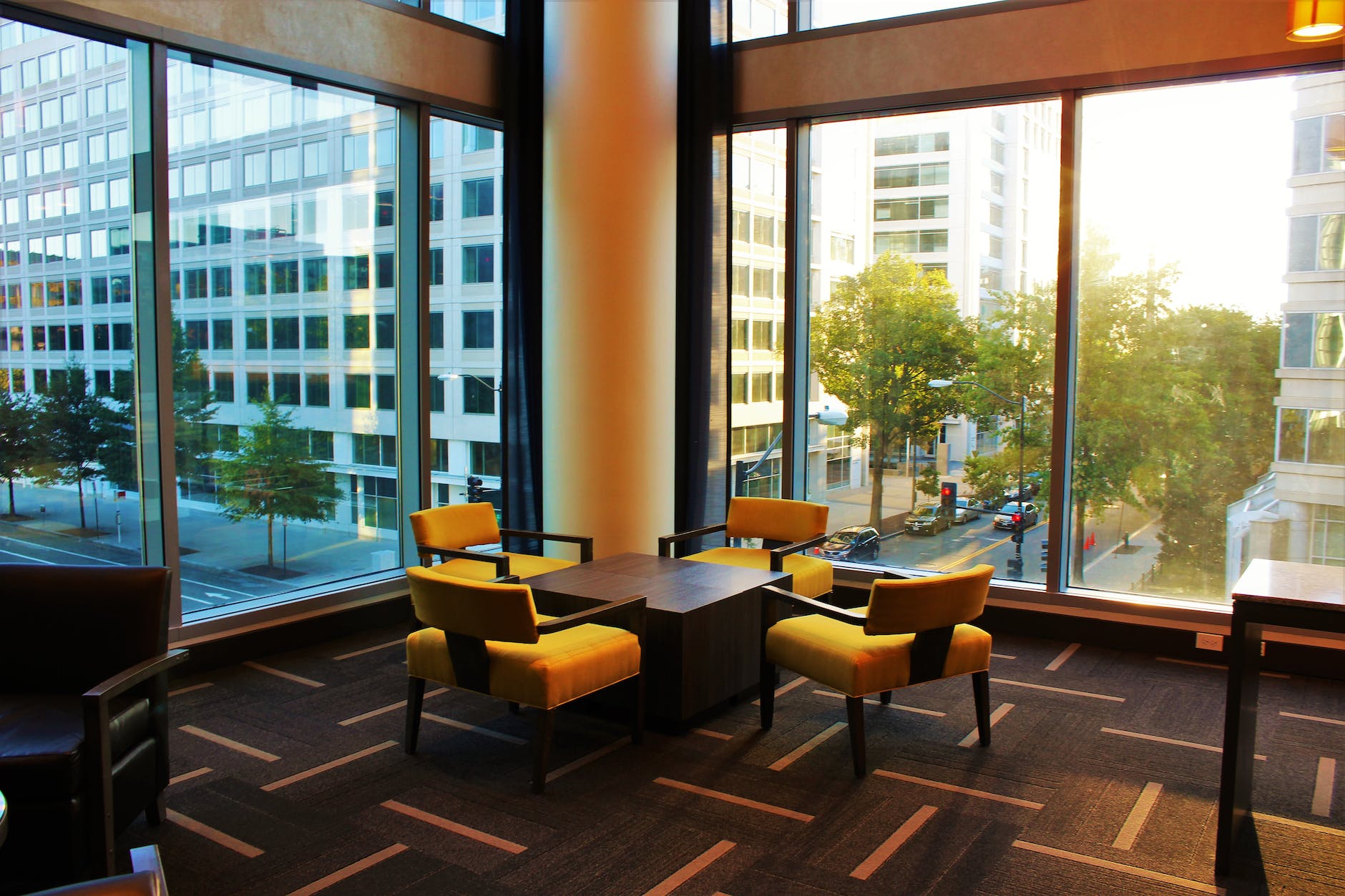 brown coffee table surrounded by four chairs