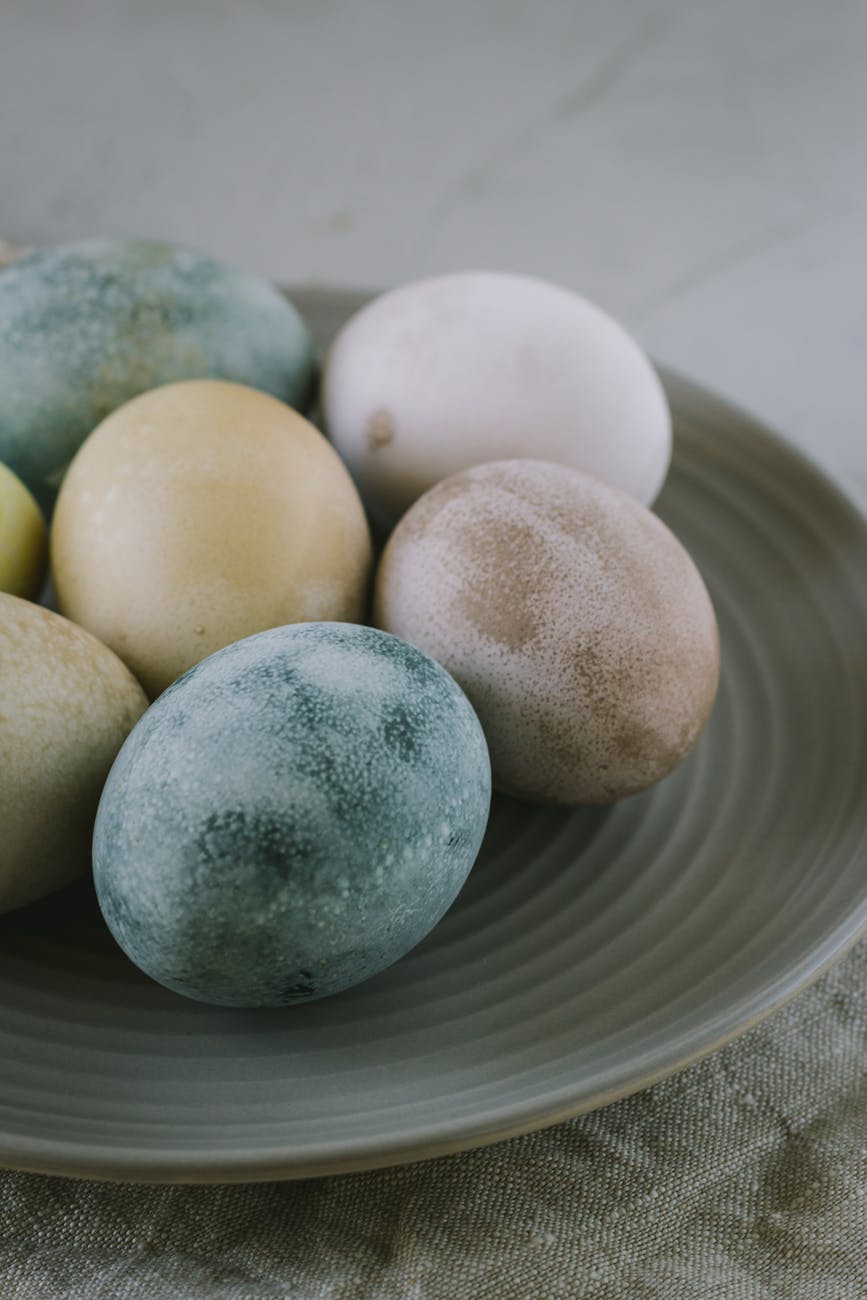 assorted color easter eggs on plate